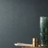 blue plain wallpaper and wall with side table and vases