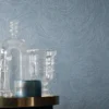 blue misc wallpaper and wall with side table and vases