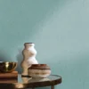 blue misc wallpaper and wall with side table and vases