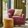 green plain curtain with armchair and pouf