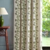 green striped curtain with side table and lamps