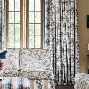 purple striped curtain with cushion and vases