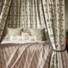 brown botanical bed with cushion and curtain