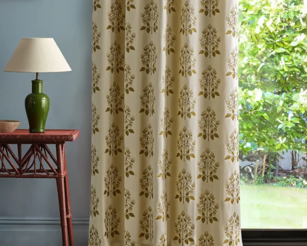 Goldings Hops Fabric - Lichen / White Blossom by brown botanical curtain with side table and lamps