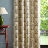 pink botanical curtain with side table and lamps