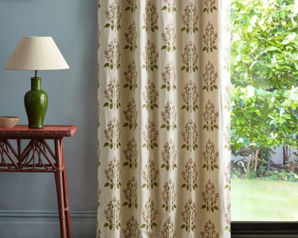 pink botanical curtain with side table and lamps