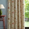 red botanical curtain with side table and lamps