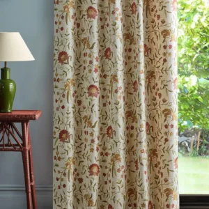 red botanical curtain with side table and lamps