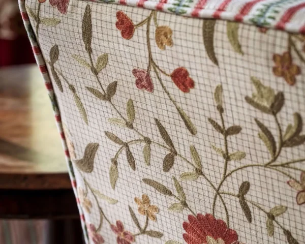 red botanical armchair with