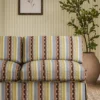 red striped sofa with plants
