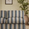 blue striped sofa with plants