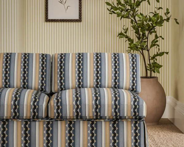 Lutley Stripe Fabric - Porcelain / Blossom by blue striped sofa with plants