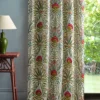red botanical curtain with side table and lamps