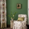 red botanical curtain with armchair and vases