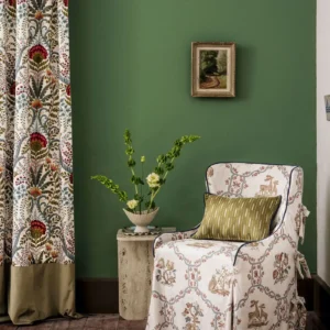 red botanical curtain with armchair and vases