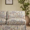 blue botanical sofa with plants