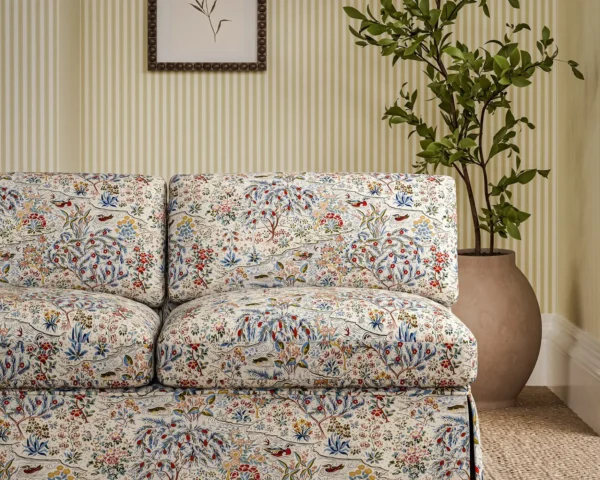 blue botanical sofa with plants