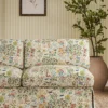 orange botanical sofa with plants