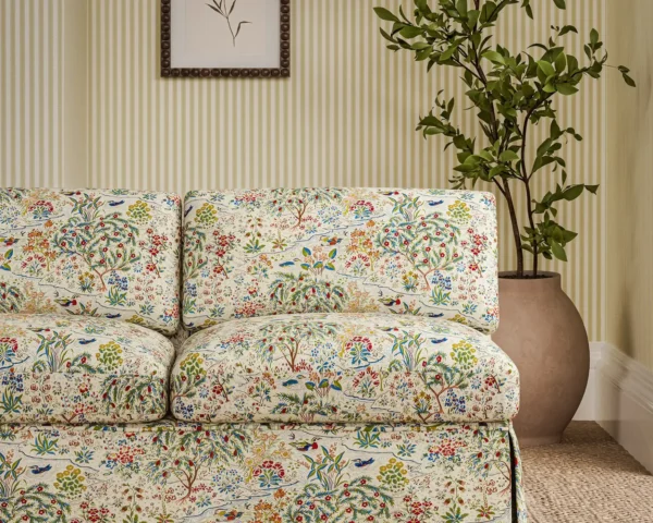 Moat Birds Fabric - Damson / Cobalt by orange botanical sofa with plants