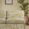 green botanical sofa with plants