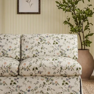 blue botanical sofa with plants