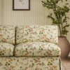 pink botanical sofa with plants