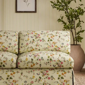 pink botanical sofa with plants