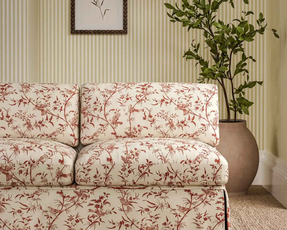 red botanical sofa with plants