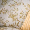 yellow botanical bed with