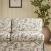 blue botanical sofa with plants