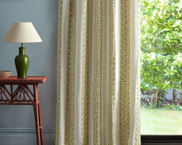 neutral striped curtain with side table and lamps