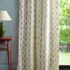 multicolour botanical curtain with side table and lamps