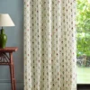 multicolour botanical curtain with side table and lamps