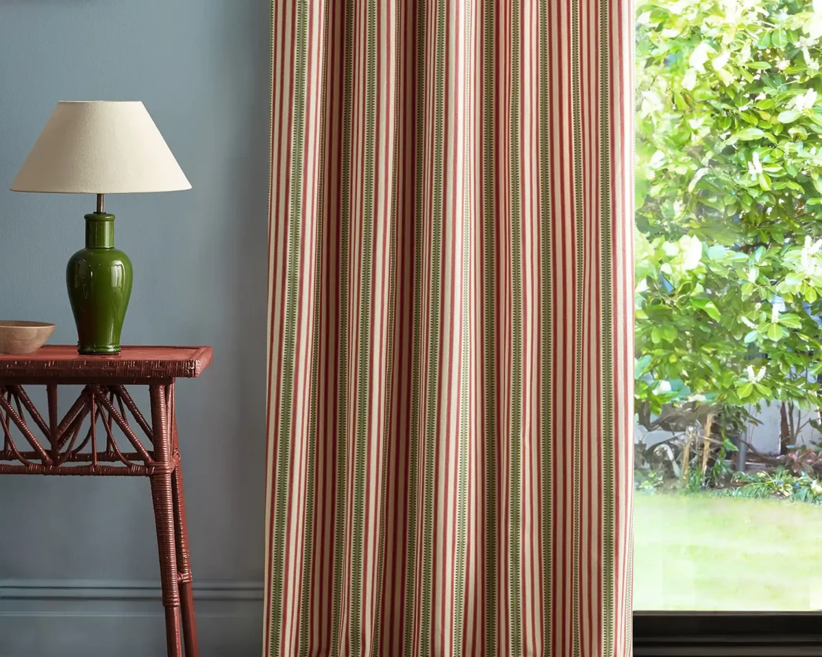 Barneby Stripe Fabric - Berry / Leaf by red striped curtain with side table and lamps