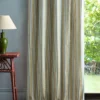 blue striped curtain with side table and lamps