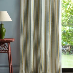 blue striped curtain with side table and lamps