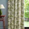 green botanical curtain with side table and lamps