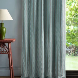 blue striped curtain with side table and lamps