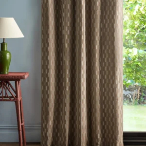 brown striped curtain with side table and lamps