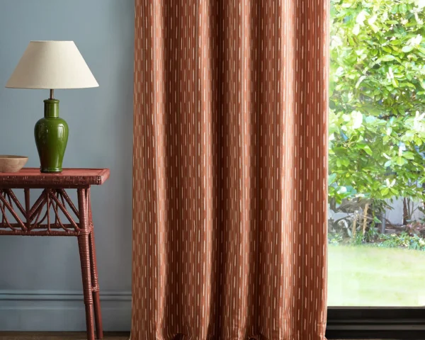Sabu Stripe Fabric - Madder / Indigo by red striped curtain with side table and lamps