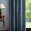 blue striped curtain with side table and lamps