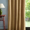 yellow striped curtain with side table and lamps