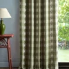 green checked curtain with side table and lamps