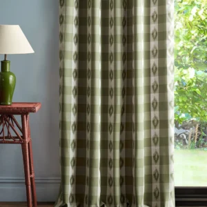 green checked curtain with side table and lamps