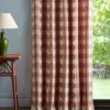 red checked curtain with side table and lamps