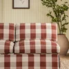 red checked sofa with plants and wall