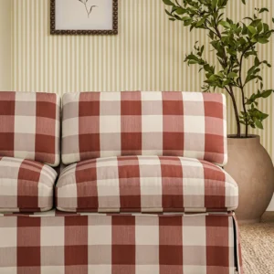 red checked sofa with plants and wall