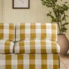 yellow checked sofa with plants and wall