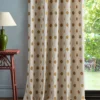 yellow spotted curtain with side table and lamps
