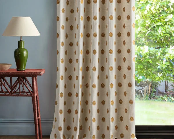 yellow spotted curtain with side table and lamps